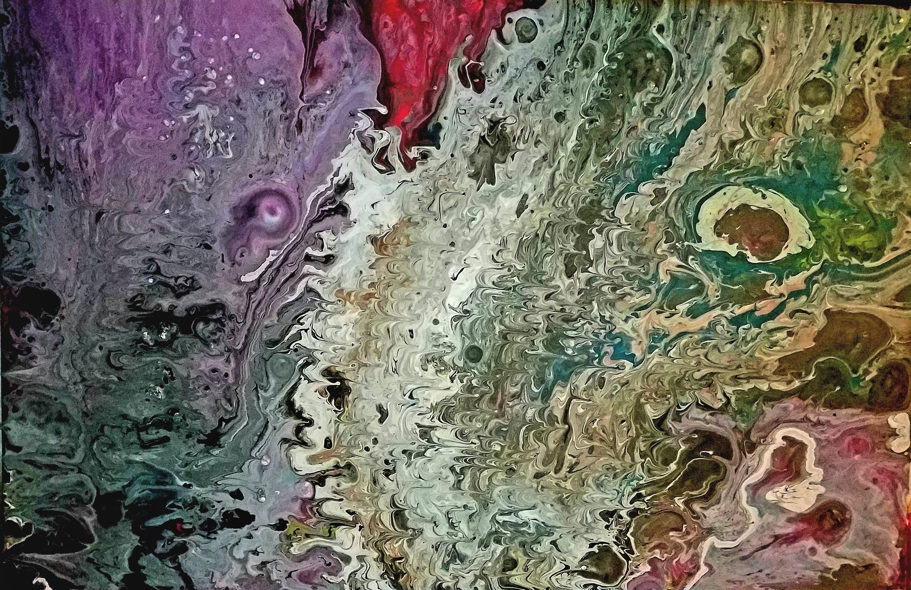 Colorful fluid acrylic pour painting with swirling purples, crimson, teal, and grey forming layered organic movement across the canvas